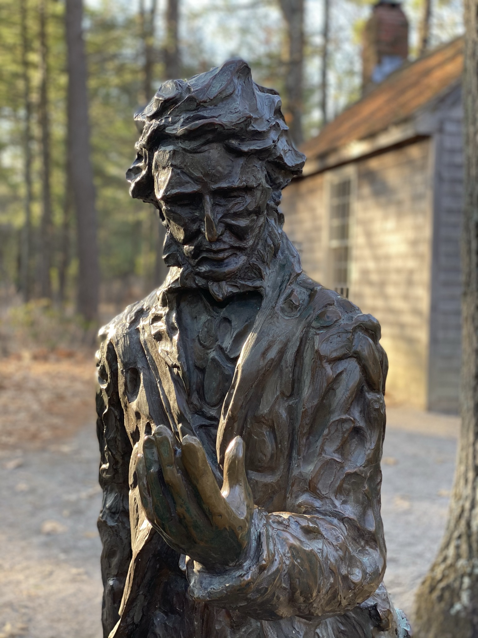 Henry David Thoreau outside a replica of his famous Walden Pond cabin in Concord, MA